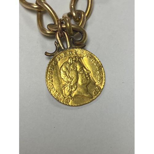 60 - A yellow metal chain, with 9ct gold dog clip, suspending an 1802 George III half guinea and two othe... 