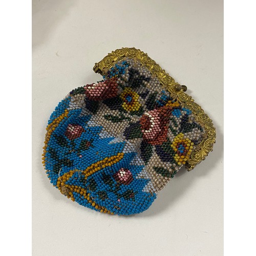 109 - A 19th century beadwork purse, with gilt metal mount -