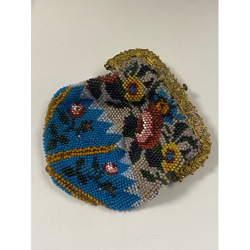 109 - A 19th century beadwork purse, with gilt metal mount -