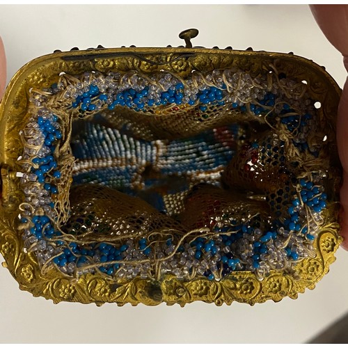 109 - A 19th century beadwork purse, with gilt metal mount -