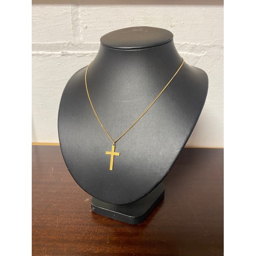 67 - A 9ct gold cross pendant on chain -