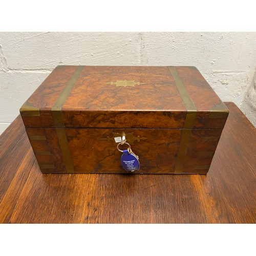 111 - A 19th century walnut writing slope, with brass mounts, lined interior and 'secret ' compartment -