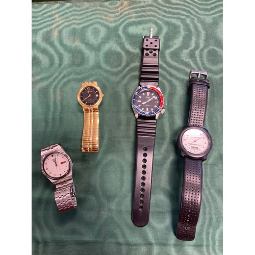 80 - A group of four wristwatches, including Seiko -