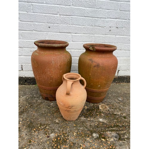 489 - Three terracotta pots -