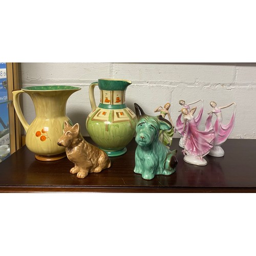 68 - Two Myott & Sons Art Deco jugs, together with Sylvac dogs and Art Deco figures -