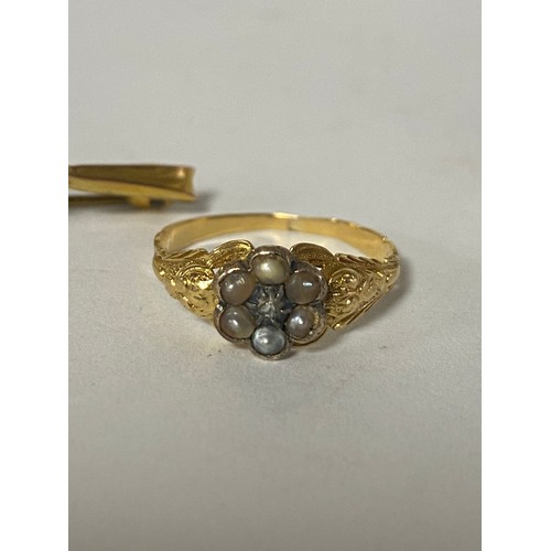 23 - A 19th century gold ring, set with a pearl and diamond cluster, together with a 9ct gold pearl ring ... 