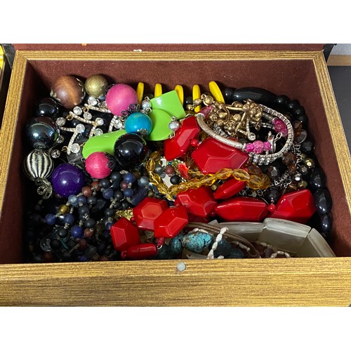 24 - Two boxes of assorted costume jewellery -