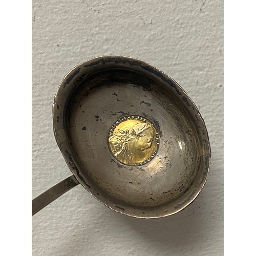 46 - A Georgian toddy ladle, the white metal bowl inset with a 1787 George III coin, to twisted baleen ha... 