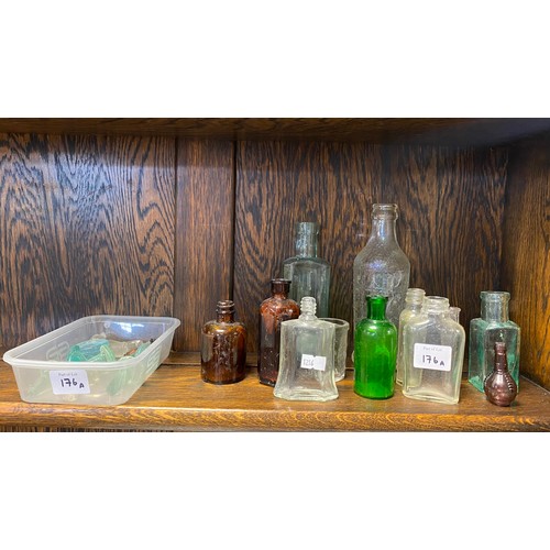 176A - A small group of glass bottles -