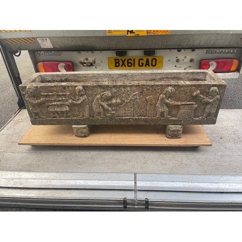 427 - A pair of garden troughs, each with figural decoration -