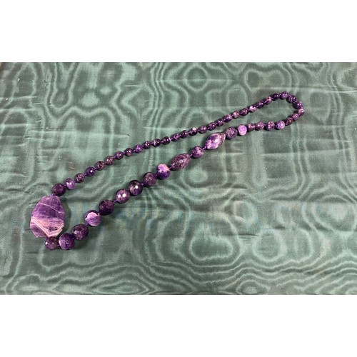 24 - A heavy faceted amethyst necklace -