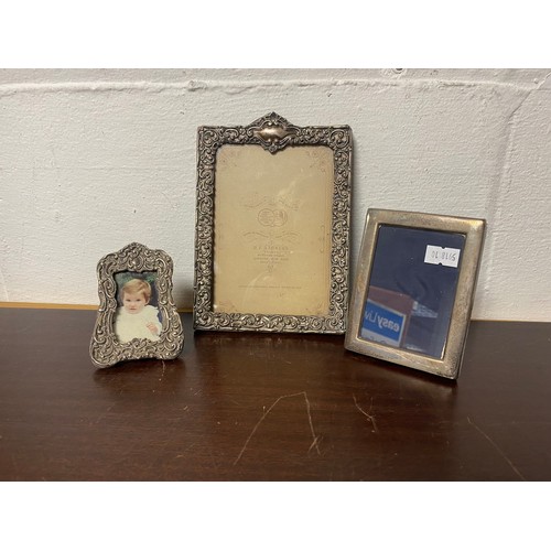 34 - Three silver faced photograph frames, various dates and makers (one missing easel back) -