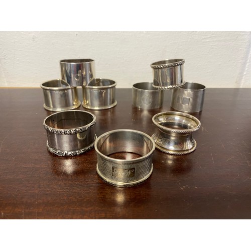 46 - A group of nine silver napkin rings, various dates and makers -