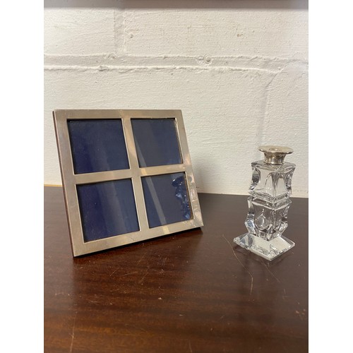 47 - A modern silver photograph frame and a silver mounted bottle (2) -