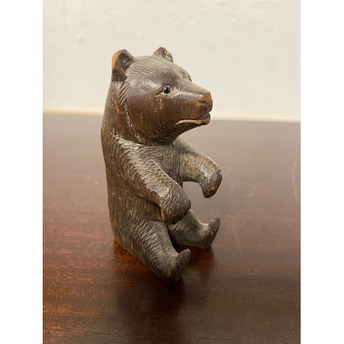 63 - A small Black Forest carved bear -