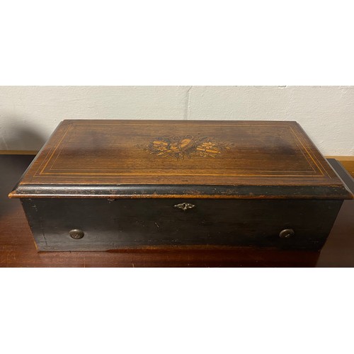 64 - A 19th century rosewood and inlaid music box, playing eight aires -