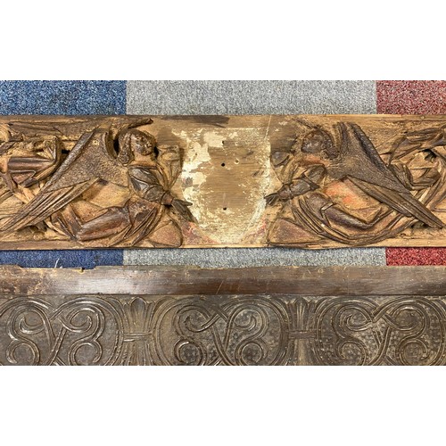 71 - A carved and painted ecclesiastical panel, (a/f), with a pair of angels and gothic tracery, together... 