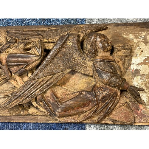 71 - A carved and painted ecclesiastical panel, (a/f), with a pair of angels and gothic tracery, together... 