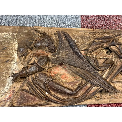 71 - A carved and painted ecclesiastical panel, (a/f), with a pair of angels and gothic tracery, together... 