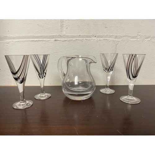 90 - A liqueur jug and four matching glasses -