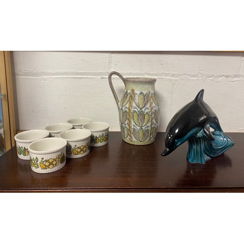 98 - A Poole Pottery dolphin, together with a Denby jug and six Royal Doulton ramekins -