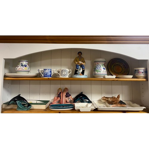 99 - A quantity of decorative china, including Poole Pottery, Royal Doulton fisherman, Bretby horse plaqu... 