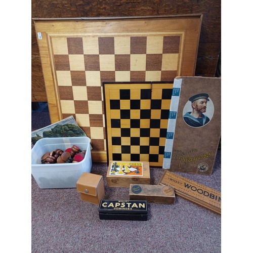 169 - A chess/backgammon board, together with a chess set, dominoes, cast tin etc -