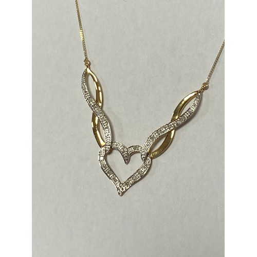 30 - A 9ct gold and diamond pendant necklace, of winged heart design -