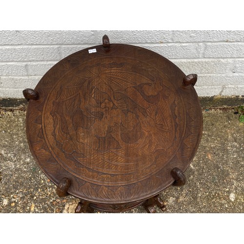 377 - A carved hardwood Chinese table -