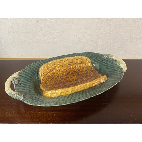 166 - A Victorian majolica asparagus dish, with moulded basket weave base and asparagus handles -