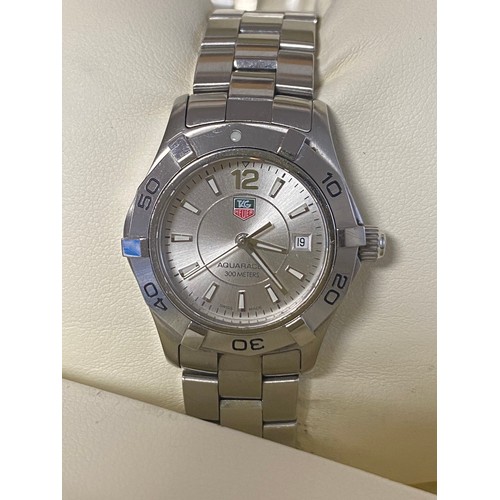 97 - A lady's Tag Heuer Aquaracer wristwatch, with box, additional links and papers -