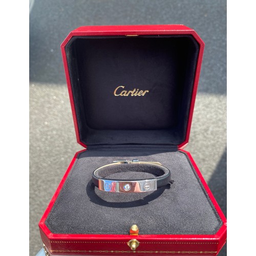 99 - Cartier: a 'Love' diamond and 18ct white gold slide bar bracelet, on leather strap, together with re... 