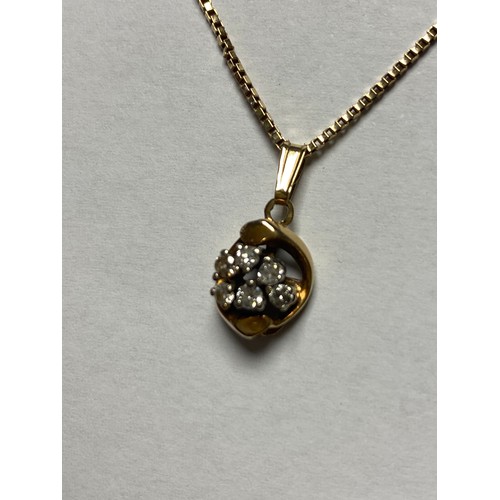 104 - A diamond set pendant, of cluster design, set in 9ct gold and to 9ct gold chain -