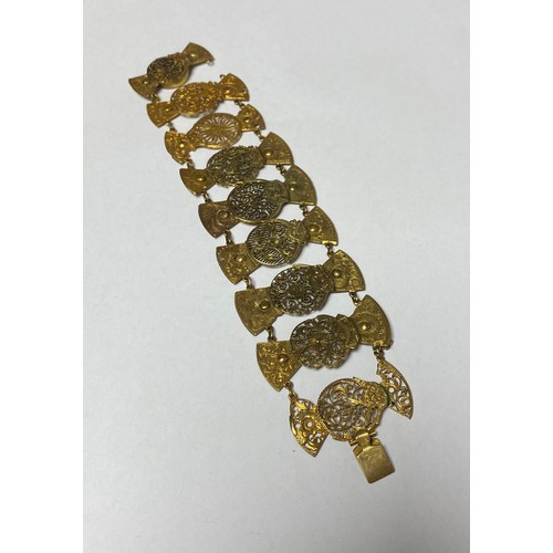 112 - A 19th century bracelet composed of pierced watch balance cocks, together with a small quantity of s... 