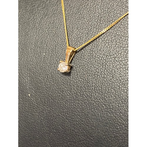 127 - A 9ct gold diamond solitaire pendant on chain -