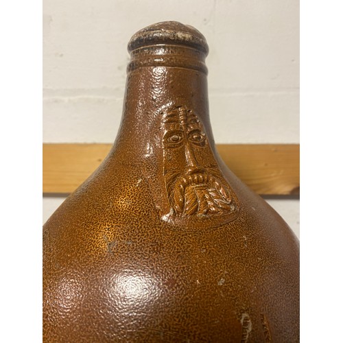 156 - A saltglaze stoneware Bellarmine jug -