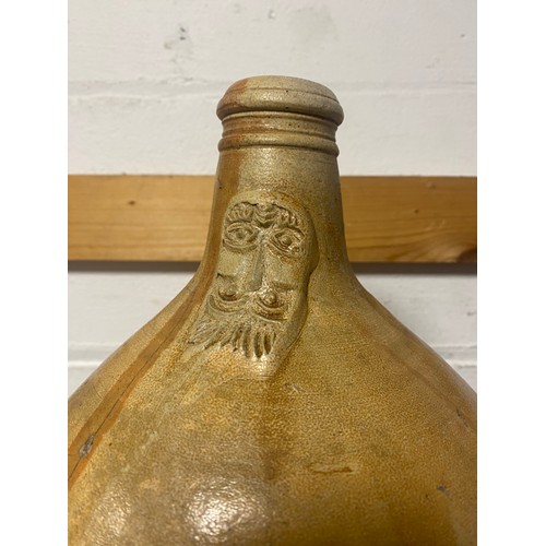 155 - A stoneware Bellarmine jug -