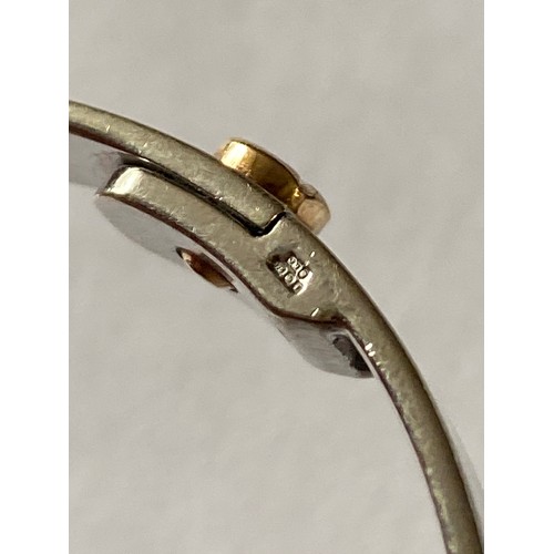 100 - A 9ct white and yellow gold Cartier style 'Love' bangle -