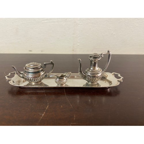 12 - A silver miniature teaset, Birmingham 1975 -