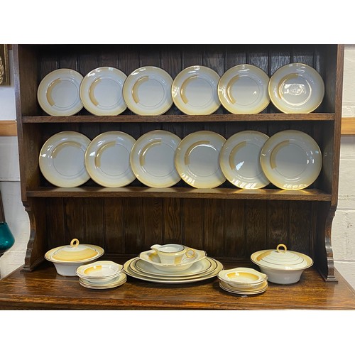 92 - A Shelley dinner service and table wares, decorated in the Art Deco style with yellow banded decorat... 