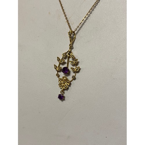 23 - An Edwardian 14ct gold openwork pendant, set with amethysts and seed pearls, to chain -