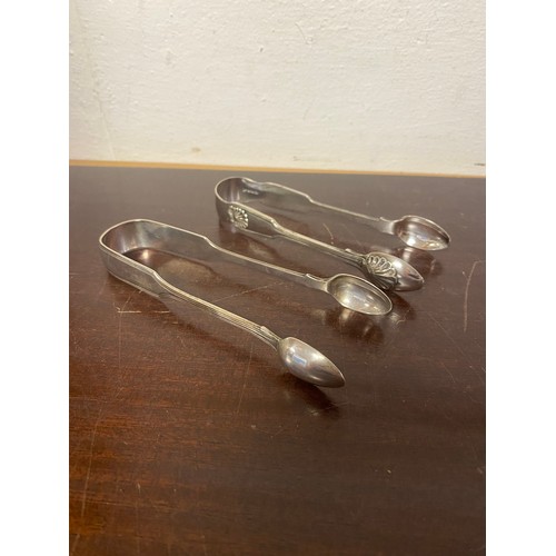 25 - A pair of Victorian silver sugar tongs, London 1847 and a pair of plated tongs -