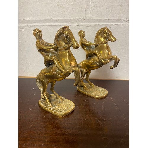 80 - A pair of brass rearing horses, each with rider -