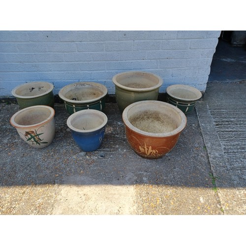 412 - A group of seven garden pots -