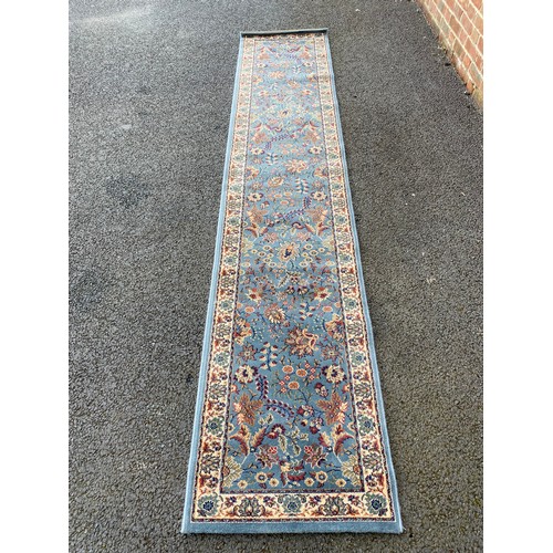 331 - A red rug approximately 160 x 120cm, another rug approximately 56 x 36cm and a runner approximately ... 