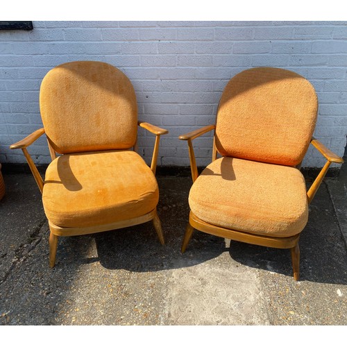 334 - A pair of Ercol fireside armchairs -