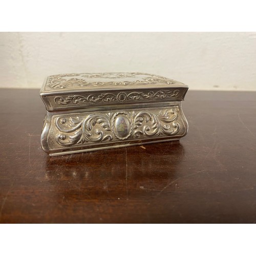 45 - A late Victorian silver box, London 1895, with repousse scrolls around a central crest of the Worshi... 