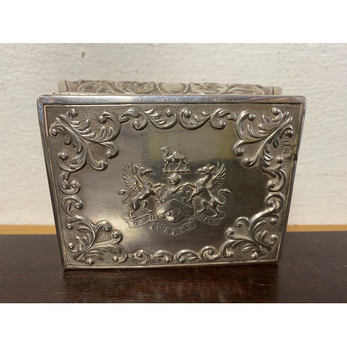 45 - A late Victorian silver box, London 1895, with repousse scrolls around a central crest of the Worshi... 