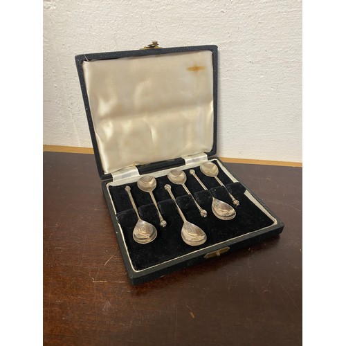 46 - A set of six silver demi-tasse spoons, Thomas Bradbury & Sons, London 1946, each with torchere finia... 