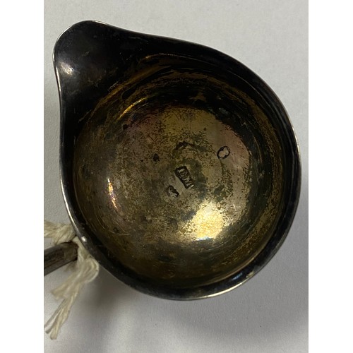 48 - A Georgian silver toddy ladle, possibly Elizabeth Morley, with silver bowl and twisted baleen handle... 